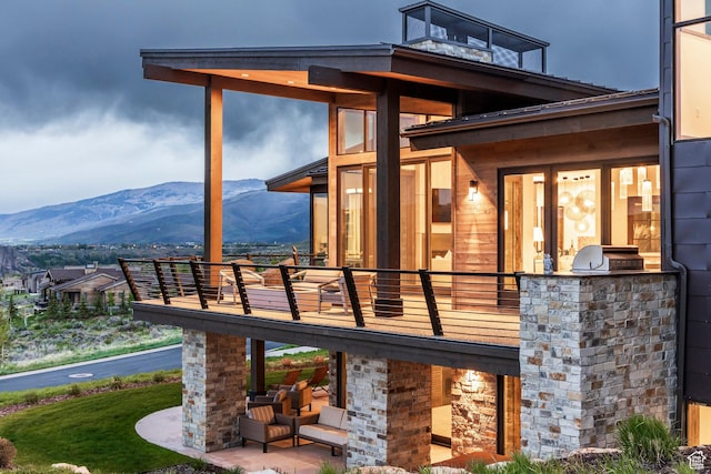 6110 E Blue Wing Loop, Kamas, UT 84036 - back of property featuring area for grilling, a mountain view, and a balcony
