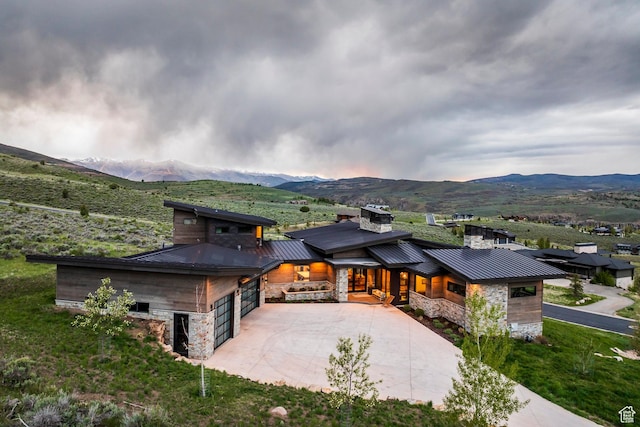 6110 E Blue Wing Loop, Kamas, UT 84036 - view of front of property with a standing seam roof, stone siding, and a mountain view