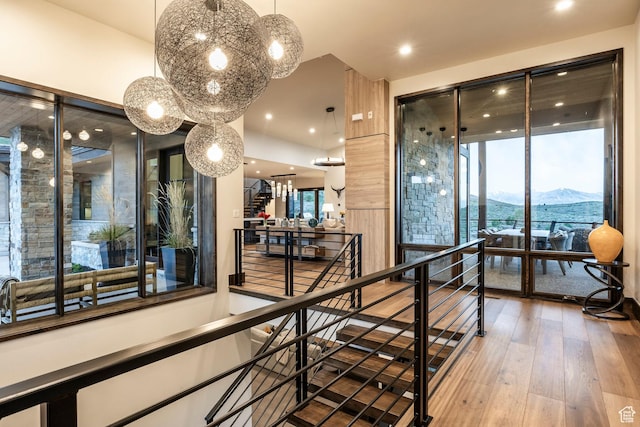 6110 E Blue Wing Loop, Kamas, UT 84036 - corridor featuring a mountain view, hardwood / wood-style floors, a chandelier, an upstairs landing, and recessed lighting