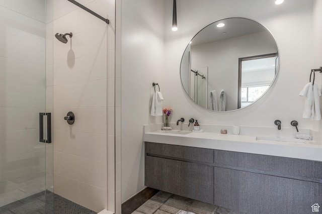 full bathroom featuring a shower stall and vanity