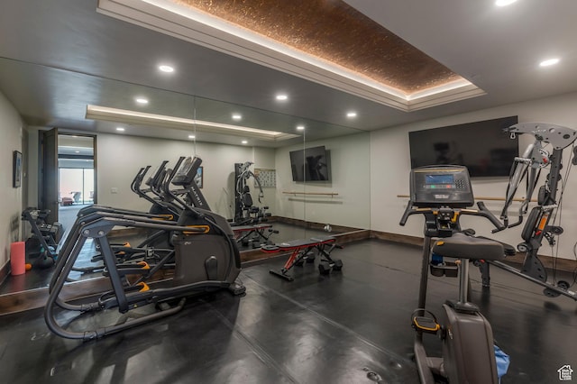 exercise room featuring baseboards and recessed lighting