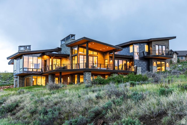 6110 E Blue Wing Loop, Kamas, UT 84036 - rear view of property with a balcony and stone siding