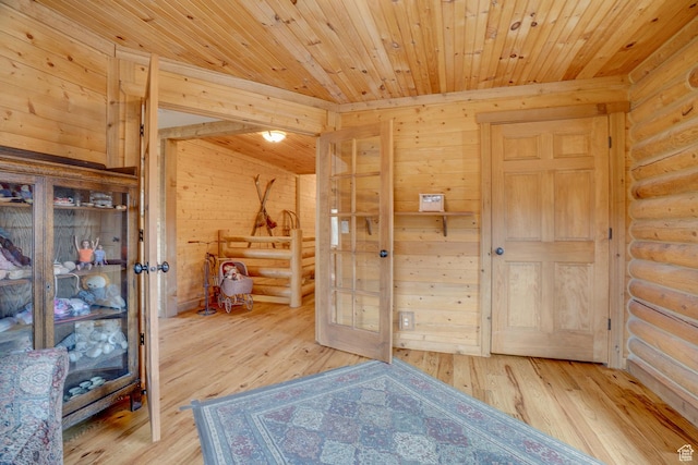 9174 Deer Creek Dr, Heber City, UT 84032 - unfurnished bedroom featuring log walls, hardwood / wood-style floors, wooden ceiling, and wooden walls