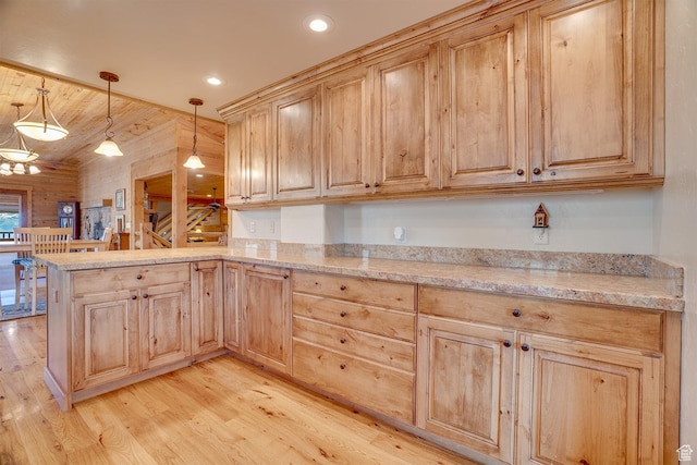 9174 Deer Creek Dr, Heber City, UT 84032 - kitchen featuring light brown cabinets, light wood-style flooring, a peninsula, hanging light fixtures, and recessed lighting