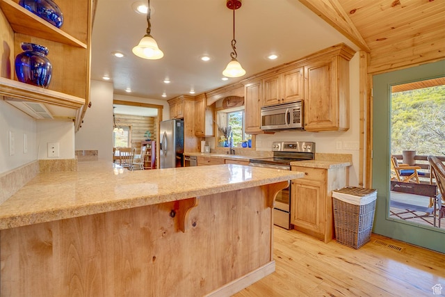 9174 Deer Creek Dr, Heber City, UT 84032 - kitchen with stainless steel appliances, light wood finished floors, recessed lighting, plenty of natural light, and a peninsula
