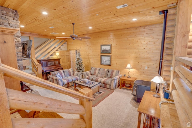 9174 Deer Creek Dr, Heber City, UT 84032 - carpeted living room featuring a wood stove, recessed lighting, wooden ceiling, ceiling fan, and stairs