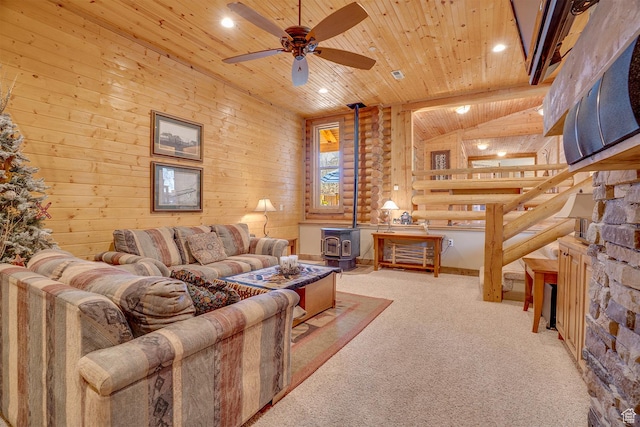9174 Deer Creek Dr, Heber City, UT 84032 - carpeted living area featuring a wood stove, wooden ceiling, a ceiling fan, and recessed lighting
