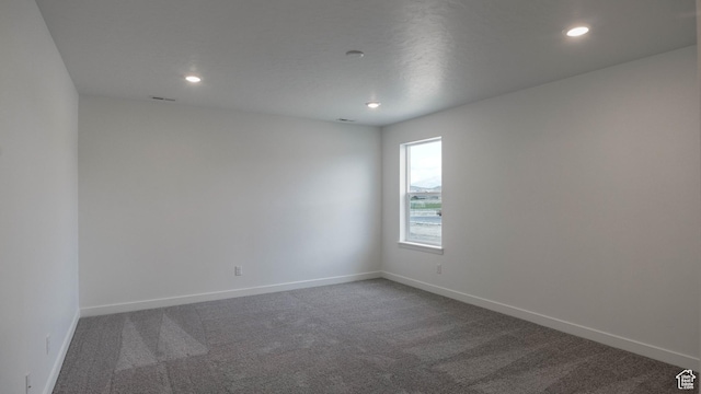 5488 N Trailside Unit 431, Eagle Mountain, UT 84005 - unfurnished room with dark carpet, recessed lighting, and baseboards