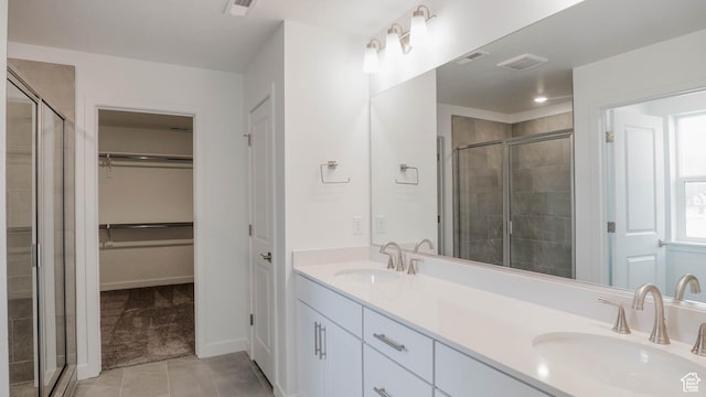 5488 N Trailside Unit 431, Eagle Mountain, UT 84005 - full bath with double vanity, a stall shower, tile patterned floors, and a spacious closet