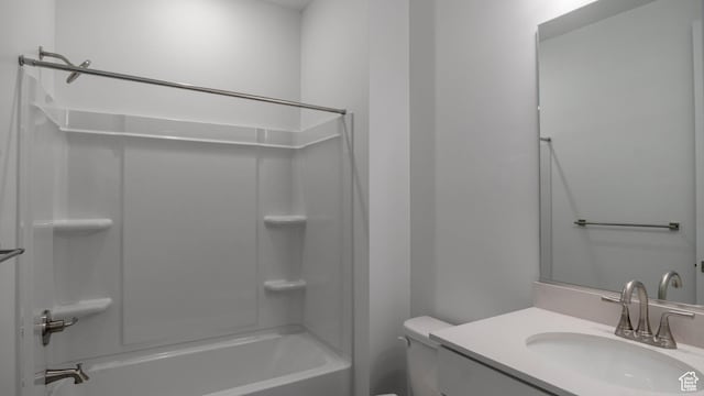 5488 N Trailside Unit 431, Eagle Mountain, UT 84005 - full bathroom featuring toilet, washtub / shower combination, and vanity