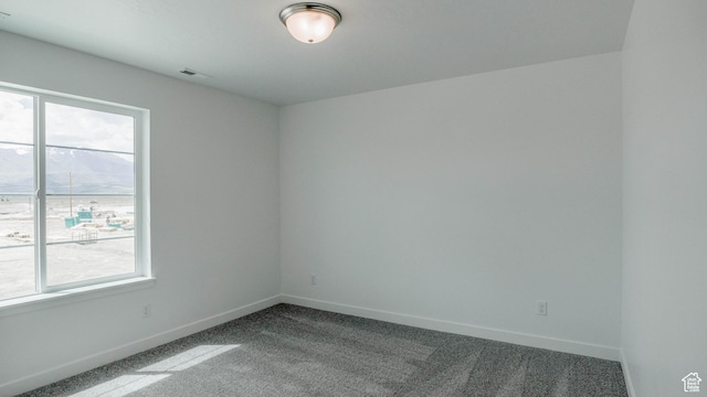 5488 N Trailside Unit 431, Eagle Mountain, UT 84005 - spare room featuring carpet, plenty of natural light, and baseboards