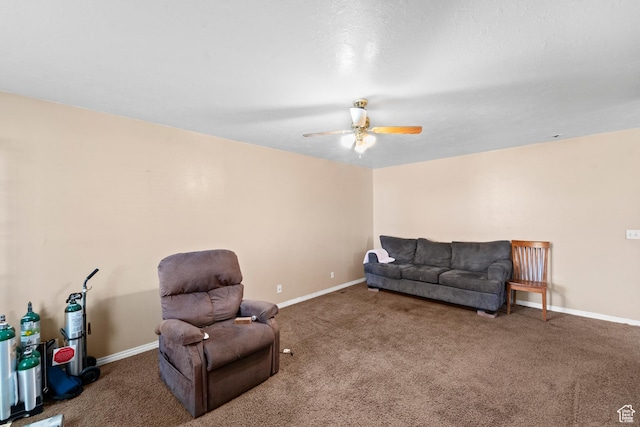 living room with carpet, ceiling fan, and baseboards
