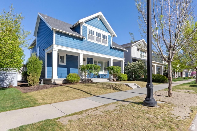 10243 S Silver Mine Rd W, South Jordan, UT 84009 - view of front of property with covered porch and a front lawn