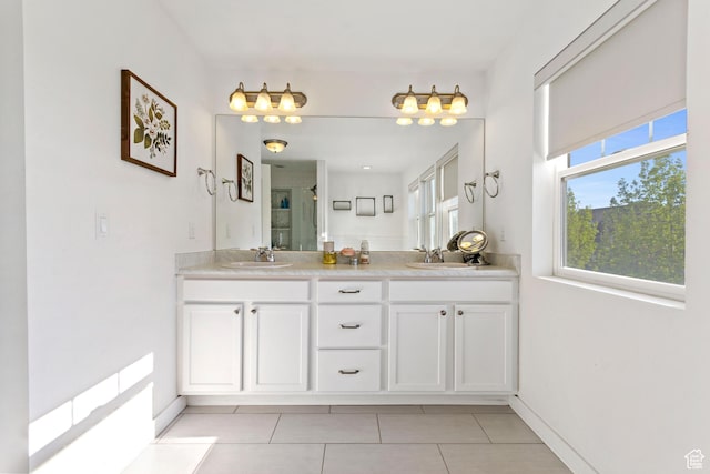 10243 S Silver Mine Rd W, South Jordan, UT 84009 - full bath featuring tile patterned flooring, double vanity, a shower stall, and baseboards
