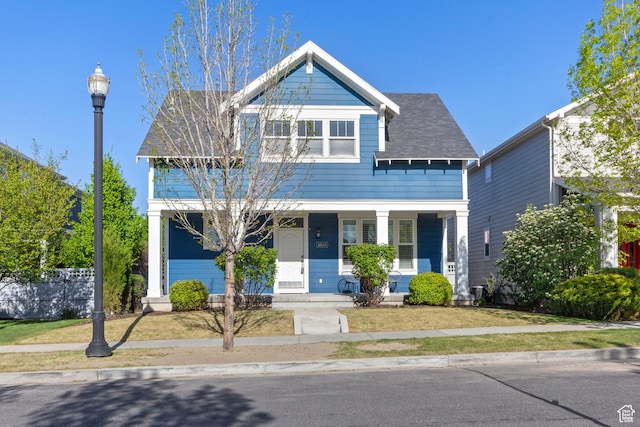 10243 S Silver Mine Rd W, South Jordan, UT 84009 - view of front of home with a porch and a front yard