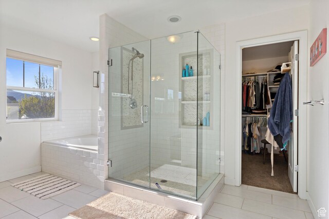 10243 S Silver Mine Rd W, South Jordan, UT 84009 - full bath with tile patterned flooring, a stall shower, a spacious closet, a garden tub, and baseboards