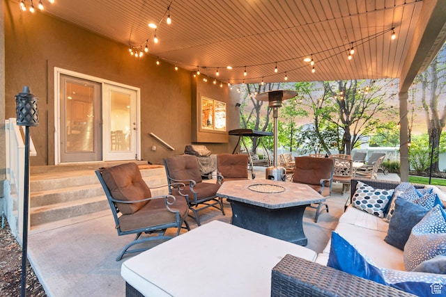 view of patio / terrace featuring an outdoor living space with a fire pit