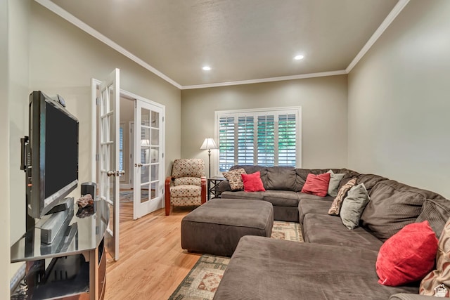 living room featuring french doors, light wood-style flooring, ornamental molding, and recessed lighting