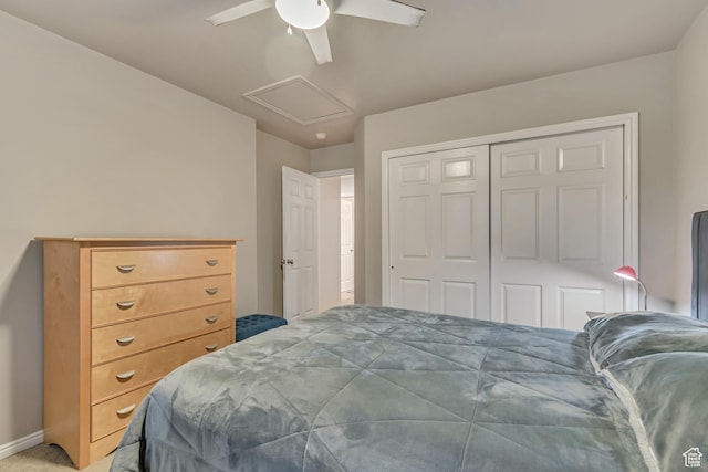 bedroom with ceiling fan, a closet, baseboards, and attic access