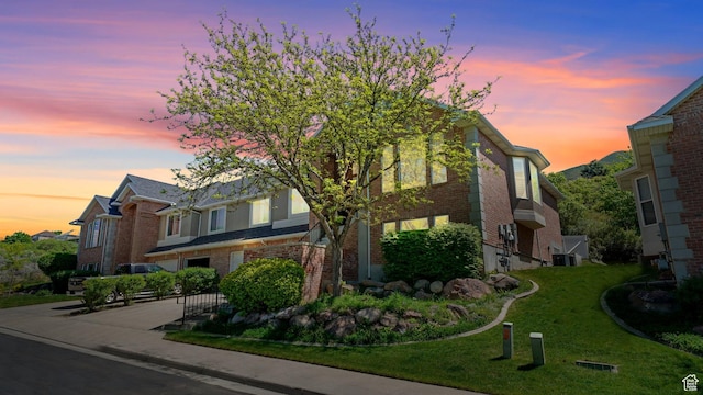426 E Brayden Way, Draper, UT 84020 - view of front facade featuring brick siding and a front lawn
