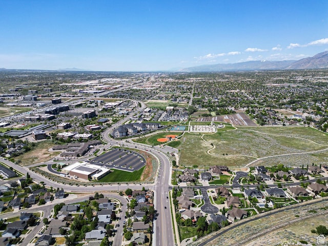 view of property location featuring mountains and nearby suburban area