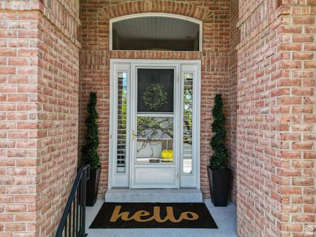 entrance to property with brick siding