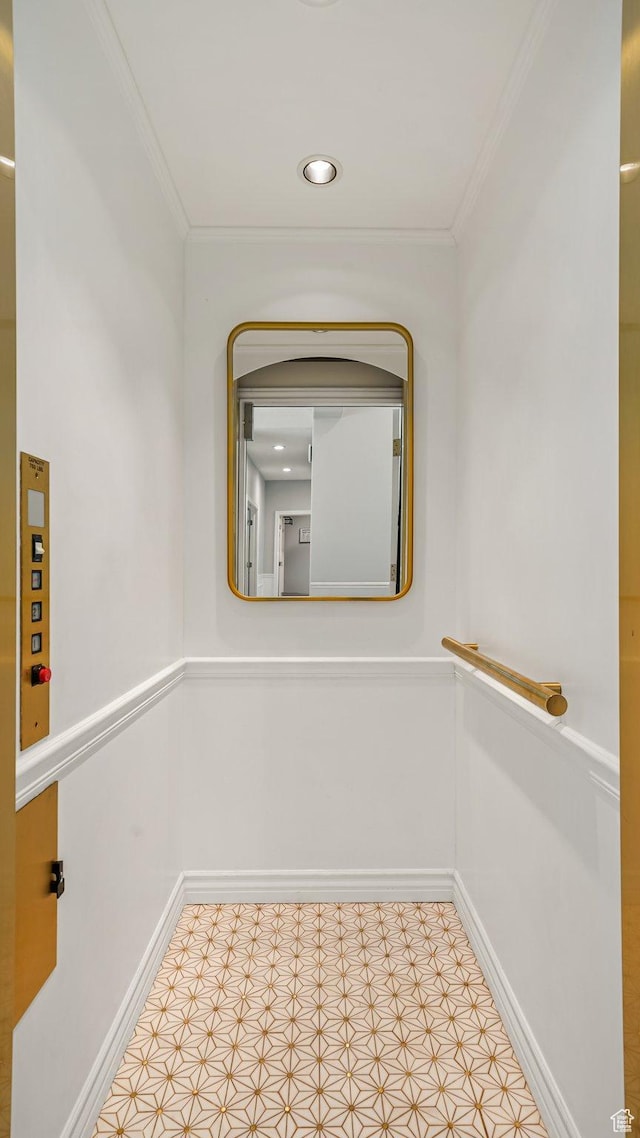 corridor featuring crown molding and baseboards