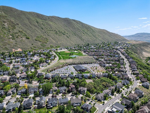 aerial view of property and surrounding area with nearby suburban area