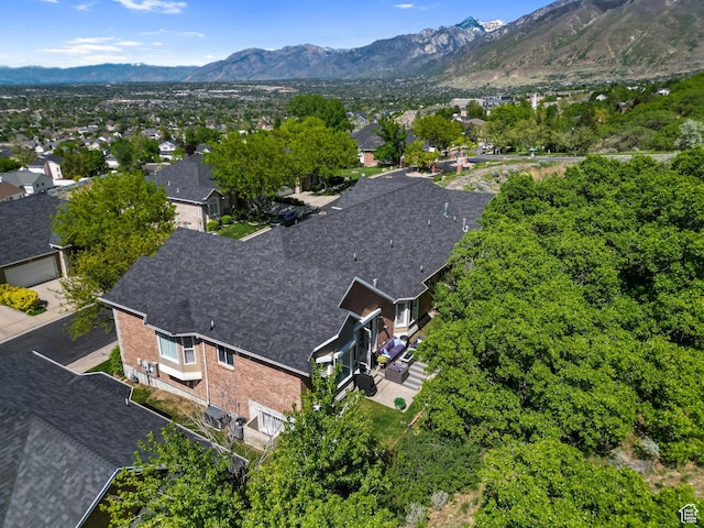 aerial view of residential area featuring a mountainous background