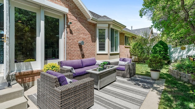 view of patio with an outdoor hangout area and fence