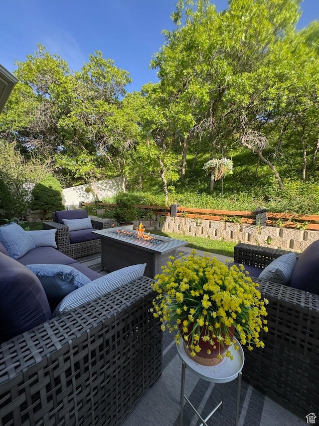 view of patio / terrace featuring an outdoor living space with a fire pit