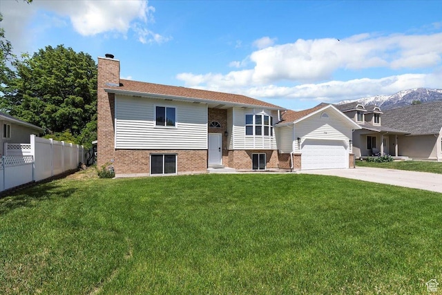 754 W 2100 N, Provo, UT 84604 - split foyer home featuring brick siding, an attached garage, driveway, and a chimney