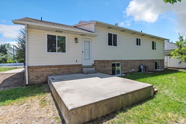 754 W 2100 N, Provo, UT 84604 - rear view of house featuring entry steps, a lawn, a patio area, and central AC unit