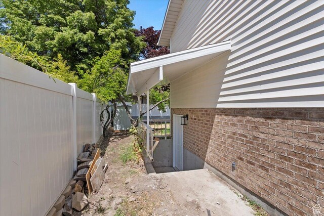 754 W 2100 N, Provo, UT 84604 - view of side of home with fence and brick siding