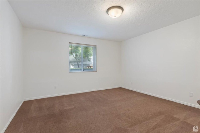 754 W 2100 N, Provo, UT 84604 - spare room with dark colored carpet, baseboards, and a textured ceiling