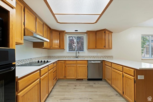 754 W 2100 N, Provo, UT 84604 - kitchen featuring black appliances, a sink, a peninsula, under cabinet range hood, and light wood-style floors
