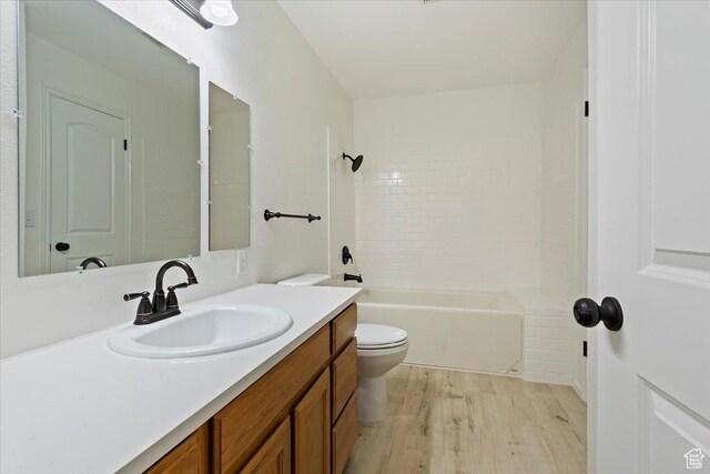 754 W 2100 N, Provo, UT 84604 - full bathroom featuring wood finished floors, toilet, vanity, and  shower combination