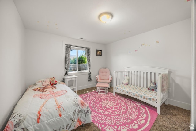 carpeted bedroom with baseboards