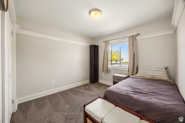 bedroom with carpet flooring and baseboards