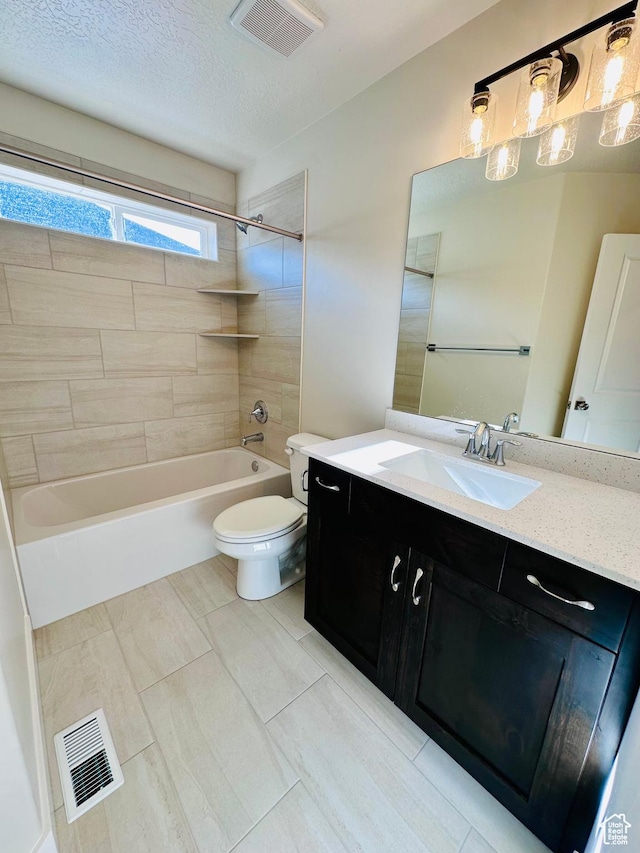 566 W 1860 N, Tooele, UT 84074 - bathroom featuring toilet, vanity, shower / washtub combination, and a textured ceiling