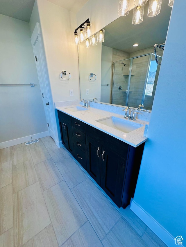 566 W 1860 N, Tooele, UT 84074 - bathroom with a stall shower, double vanity, and baseboards