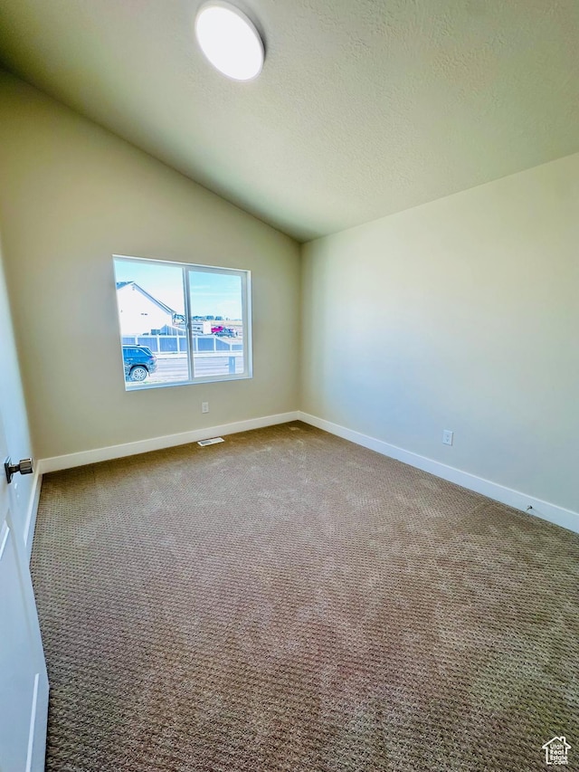 566 W 1860 N, Tooele, UT 84074 - carpeted empty room featuring baseboards, vaulted ceiling, and a textured ceiling