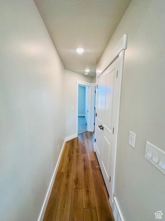 566 W 1860 N, Tooele, UT 84074 - corridor with baseboards and wood finished floors