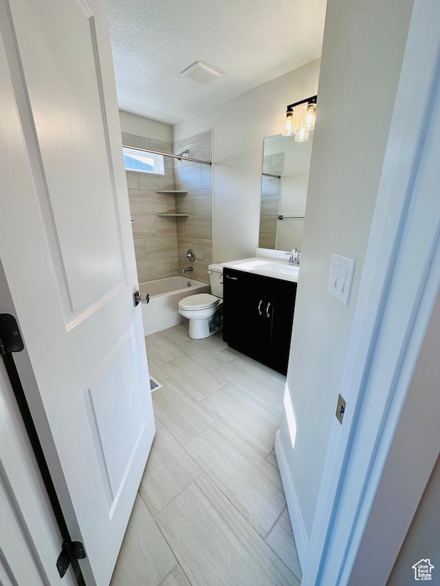 566 W 1860 N, Tooele, UT 84074 - full bathroom featuring vanity, toilet, a textured ceiling, and bathtub / shower combination