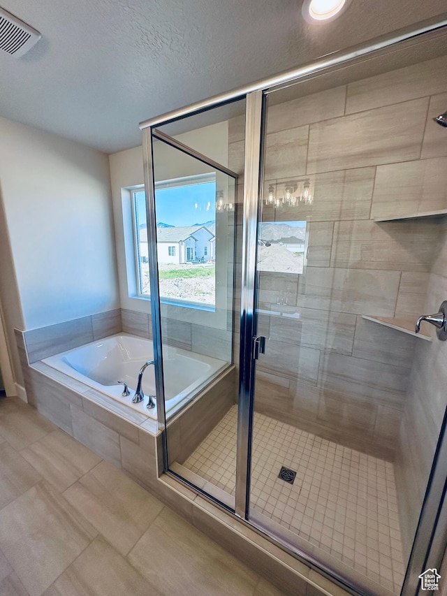 566 W 1860 N, Tooele, UT 84074 - bathroom featuring a garden tub, a stall shower, and tile patterned floors