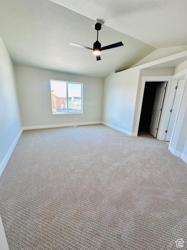 566 W 1860 N, Tooele, UT 84074 - unfurnished room featuring baseboards, light colored carpet, ceiling fan, vaulted ceiling, and a textured ceiling