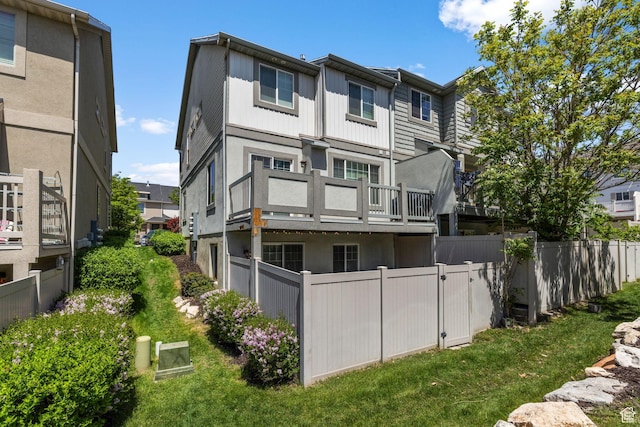 2051 W 1080 N, Provo, UT 84604 - back of property with fence, stucco siding, a balcony, and a residential view