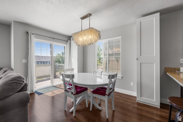 2051 W 1080 N, Provo, UT 84604 - dining room with dark wood-style floors, a chandelier, a textured ceiling, and baseboards