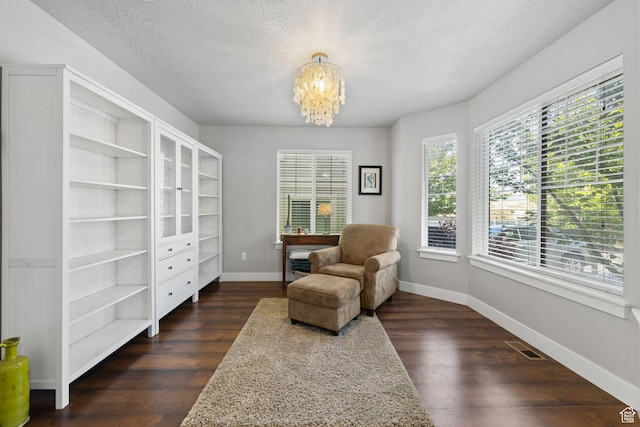 2051 W 1080 N, Provo, UT 84604 - living area with a chandelier, baseboards, dark wood-style floors, a textured ceiling, and an office area