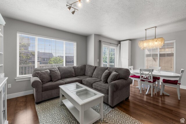 2051 W 1080 N, Provo, UT 84604 - living area featuring wood finished floors, a textured ceiling, a chandelier, and baseboards